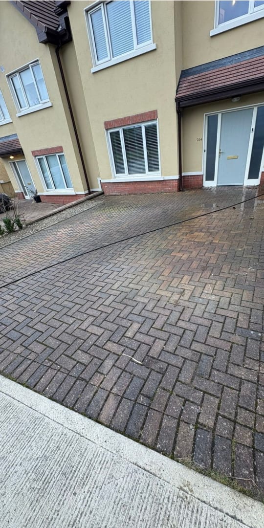 Block-paved driveway before power washing in Limerick — dirty and stained